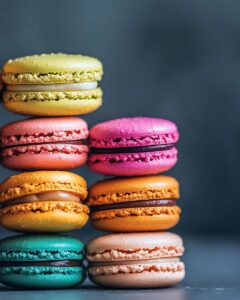 "Colorful macarons on baking sheet showcasing an easy macaron recipe with essential ingredients."